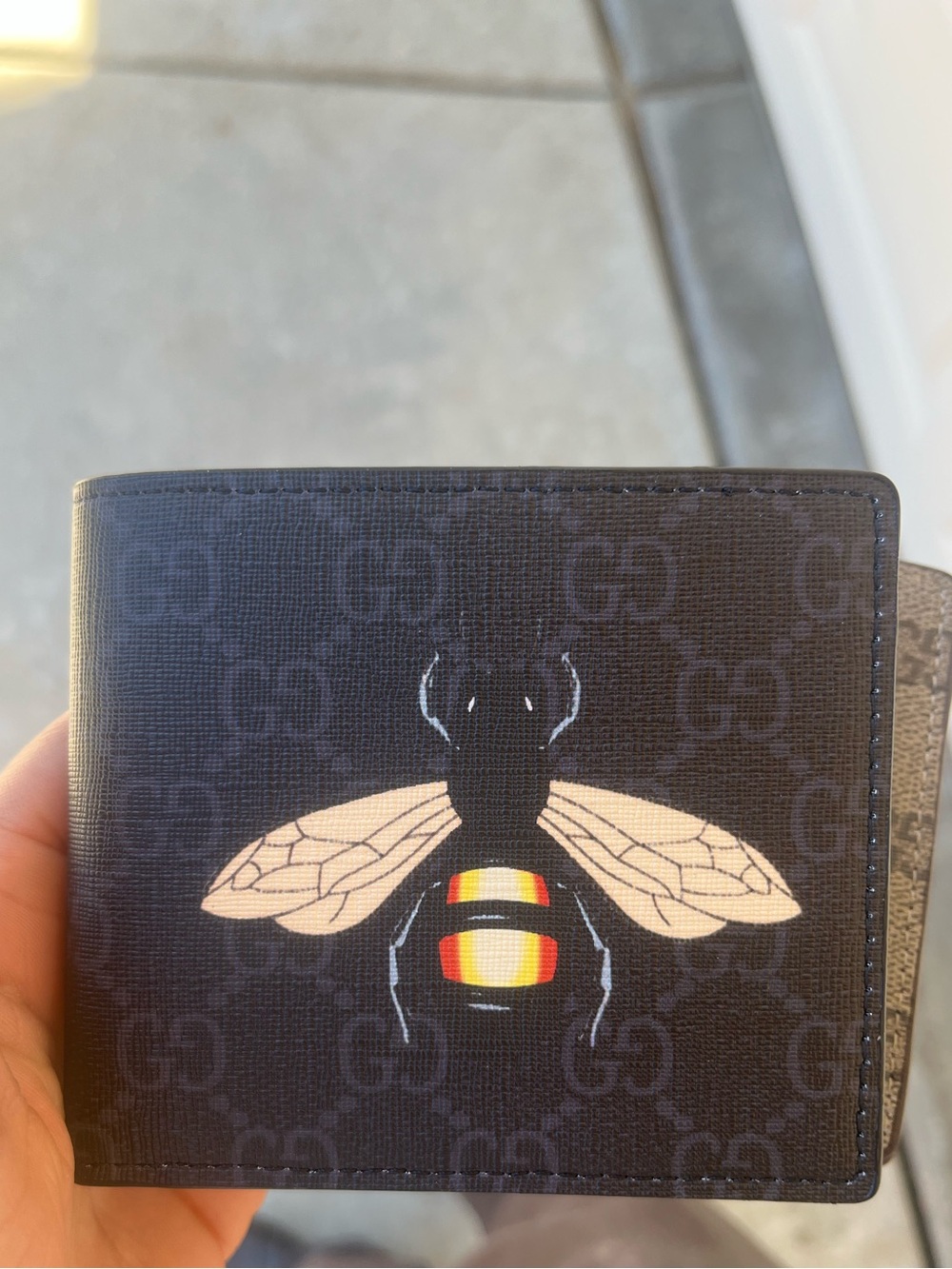 Nike Black Wallet with Bee Motif and Yellow-Red Accent
